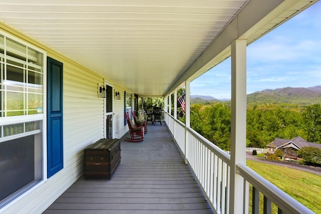 wooden terrace featuring a mountain view