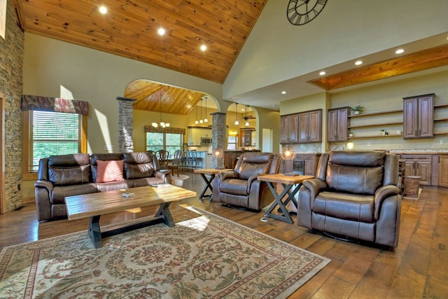 living room with arched walkways, high vaulted ceiling, hardwood / wood-style flooring, and wood ceiling