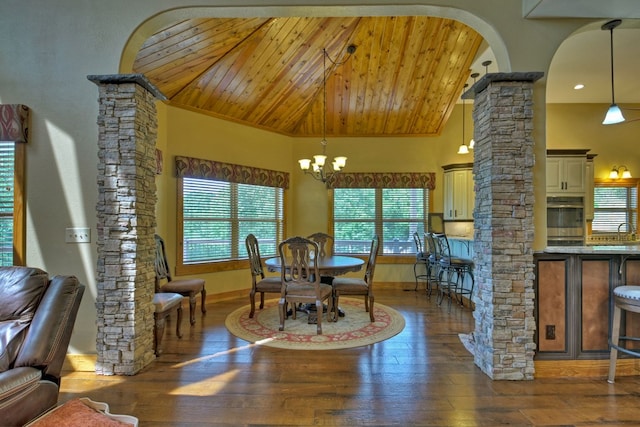 dining space featuring wood ceiling, an inviting chandelier, decorative columns, and wood-type flooring