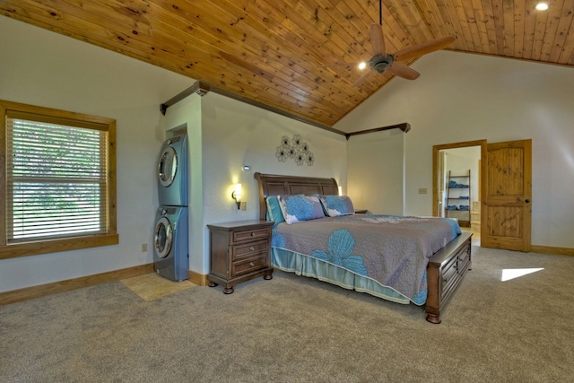 carpeted bedroom with baseboards, stacked washer / dryer, wooden ceiling, ceiling fan, and high vaulted ceiling