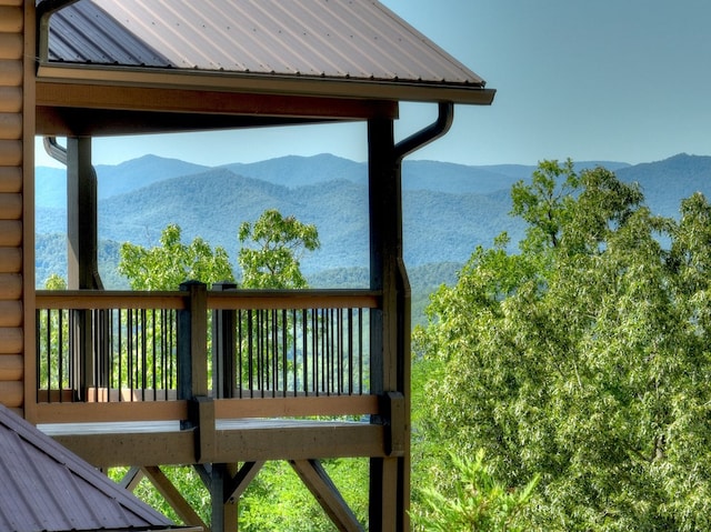 wooden deck with a mountain view