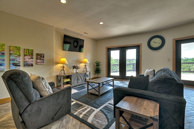 living area featuring french doors and recessed lighting