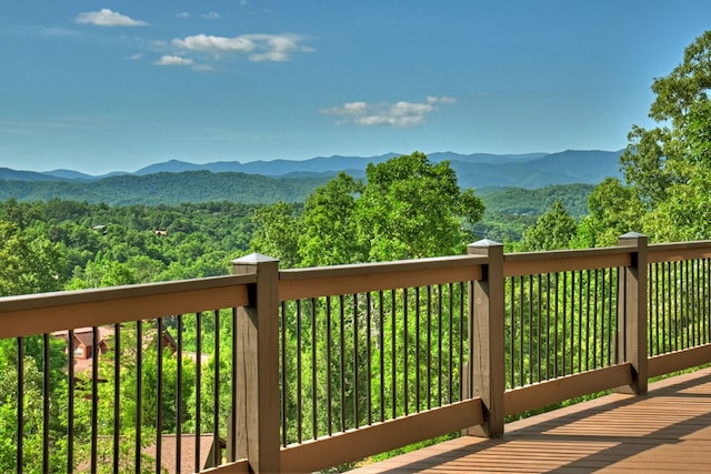 wooden terrace with a mountain view and a forest view