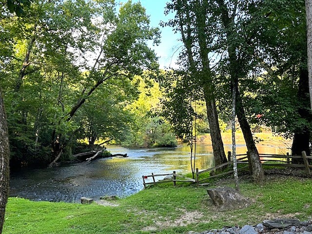 view of water feature with fence