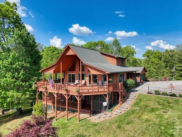 246 Serenity Pointe Dr, Murphy, NC 28906 - back of property featuring a lawn, a wooden deck, and stairway