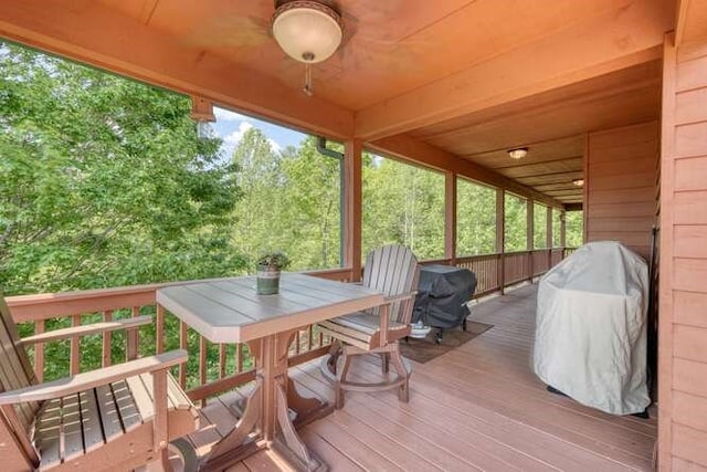 wooden terrace with outdoor dining space