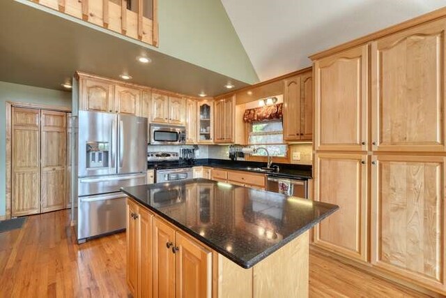 246 Serenity Pointe Dr, Murphy, NC 28906 - kitchen with light wood finished floors, light brown cabinets, vaulted ceiling, and stainless steel appliances
