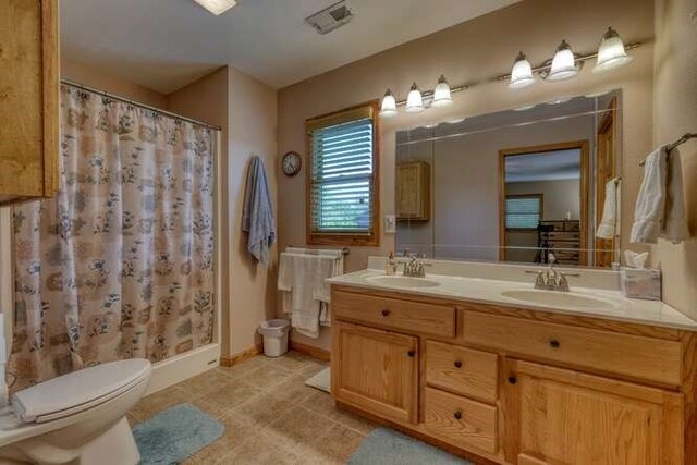 246 Serenity Pointe Dr, Murphy, NC 28906 - full bath with double vanity, a sink, tile patterned floors, and toilet