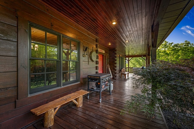 wooden terrace with a porch