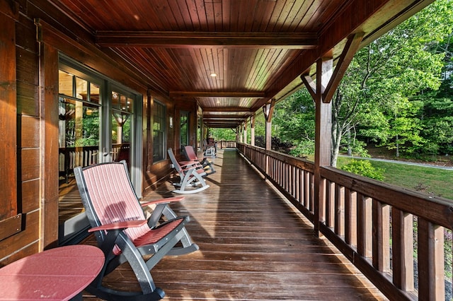 wooden terrace with a porch