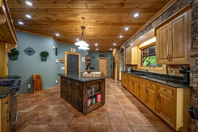 kitchen featuring stainless steel range with gas cooktop, wooden ceiling, recessed lighting, a sink, and a kitchen island