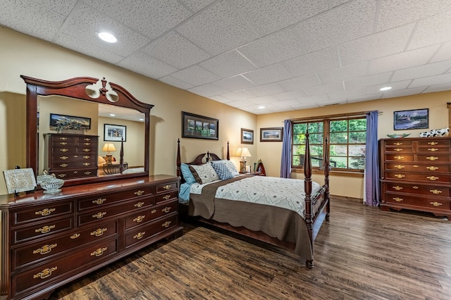 bedroom with dark wood-style flooring and recessed lighting
