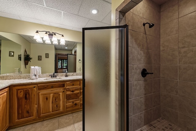 bathroom with a stall shower and vanity