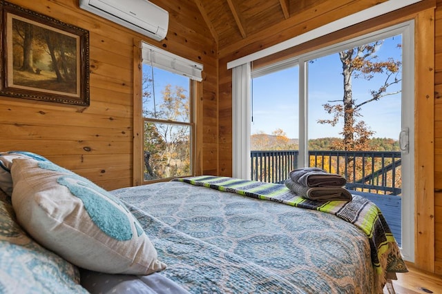 bedroom featuring wood walls, vaulted ceiling with beams, hardwood / wood-style flooring, access to outside, and a wall unit AC