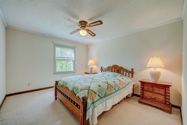 bedroom with carpet flooring, crown molding, baseboards, and ceiling fan