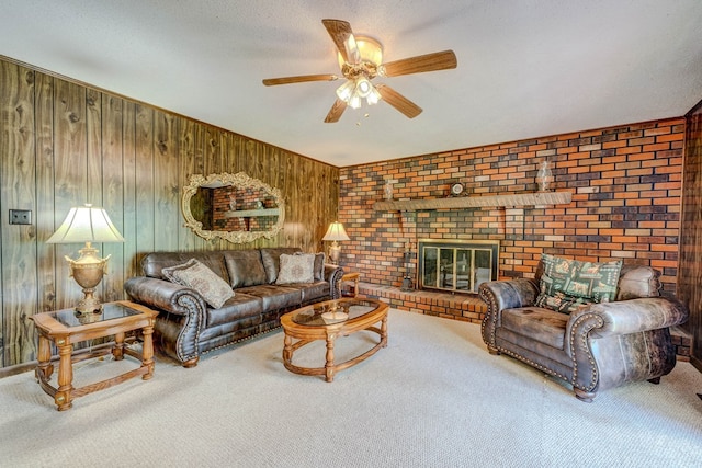 carpeted living area with a ceiling fan and wood walls