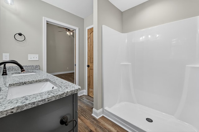 89 Pamela Ct, Ellijay, GA 30540 - full bath featuring wood finished floors, double vanity, a shower, and ceiling fan