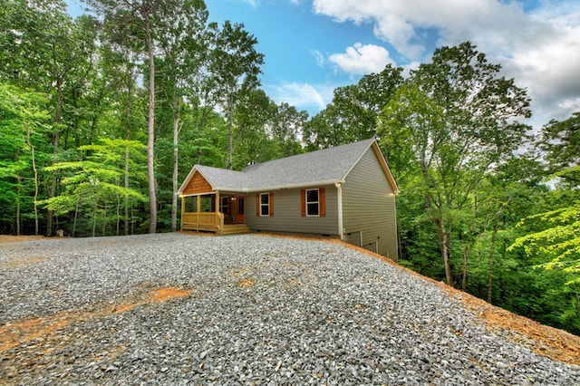 89 Pamela Ct, Ellijay, GA 30540 - rustic home featuring gravel driveway, a shingled roof, and covered porch