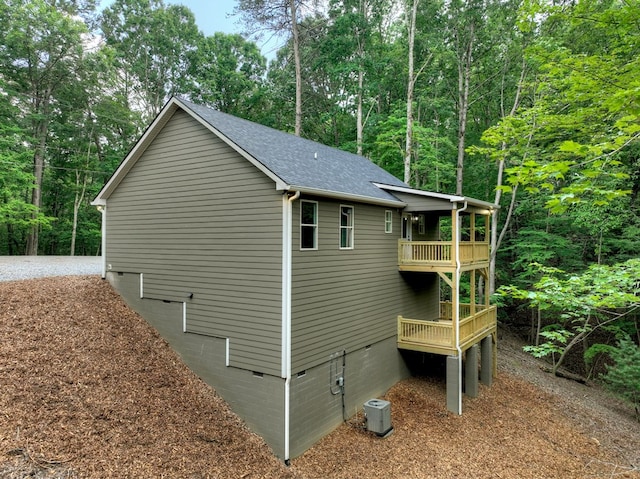 89 Pamela Ct, Ellijay, GA 30540 - view of home's exterior with crawl space, a balcony, roof with shingles, and a wooded view