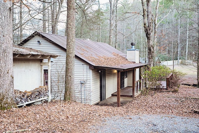 view of side of home with a chimney