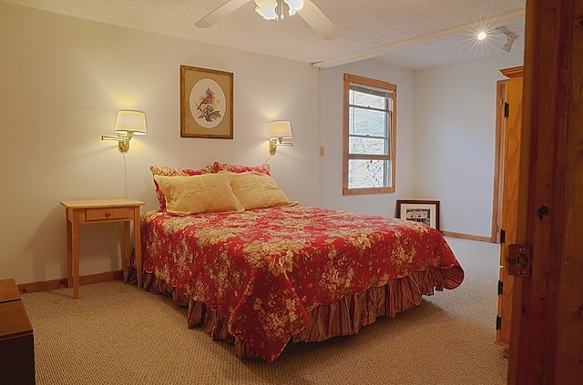 bedroom with carpet floors, ceiling fan, a textured ceiling, and baseboards