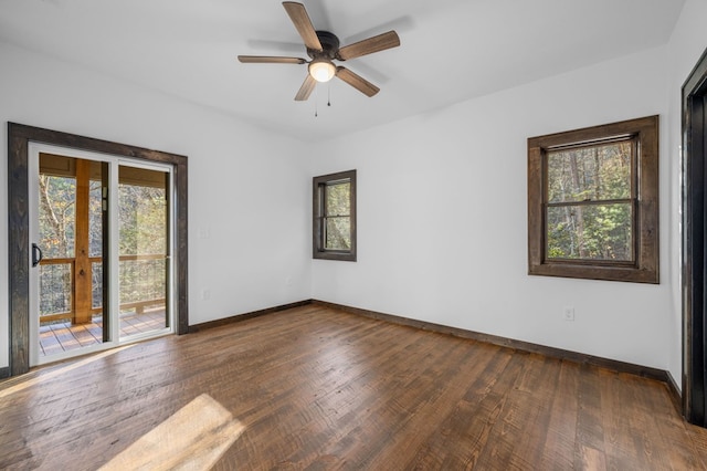 empty room featuring french doors, dark hardwood / wood-style flooring, and ceiling fan