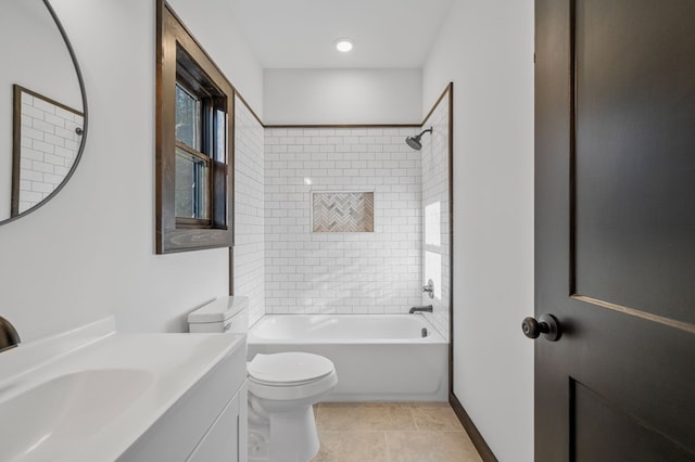 full bathroom featuring tile patterned floors, tiled shower / bath combo, toilet, and vanity