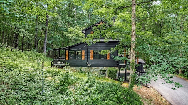 view of home's exterior featuring a deck