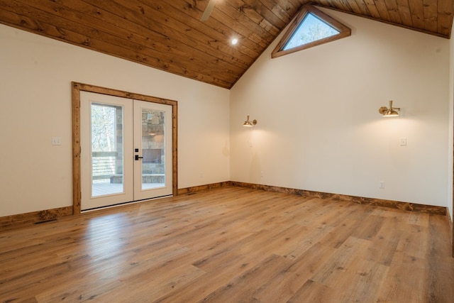 empty room featuring wood finished floors, wood ceiling, and french doors