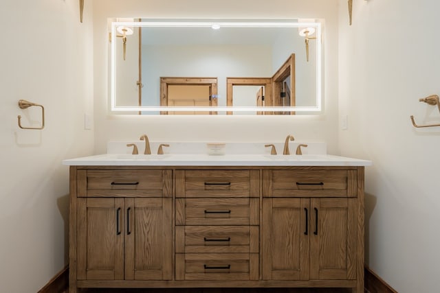 bathroom with double vanity and a sink