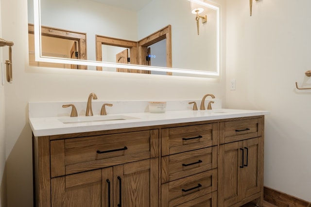 full bath featuring double vanity and a sink