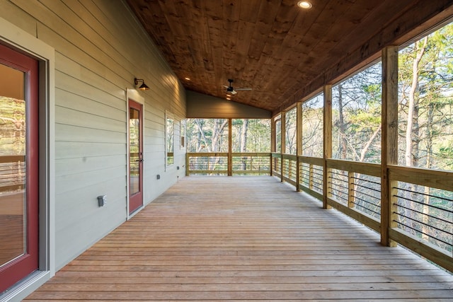 wooden deck with a porch and a ceiling fan