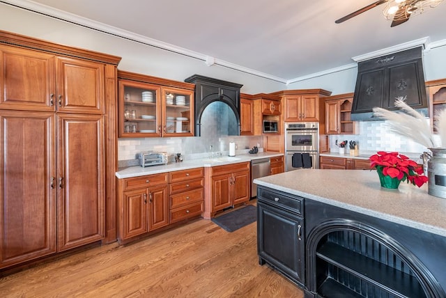 33 Tj Mote Rd, Dahlonega, GA 30533 - kitchen featuring stainless steel appliances, brown cabinets, light countertops, tasteful backsplash, and ornamental molding