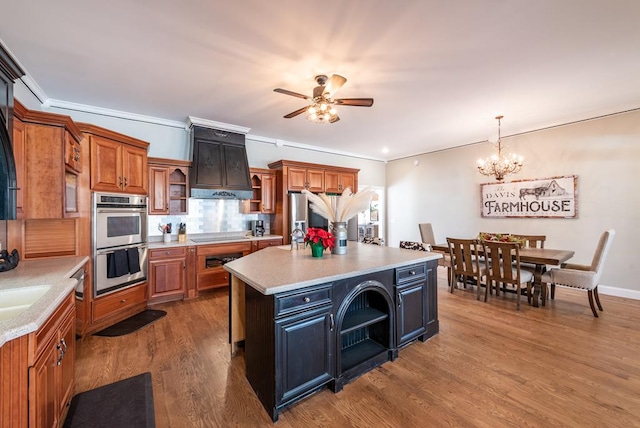 33 Tj Mote Rd, Dahlonega, GA 30533 - kitchen with open shelves, stainless steel double oven, light countertops, brown cabinets, and ceiling fan