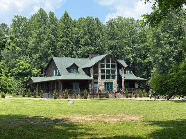 33 Tj Mote Rd, Dahlonega, GA 30533 - view of front of home with stone siding, a front yard, a chimney, and a view of trees