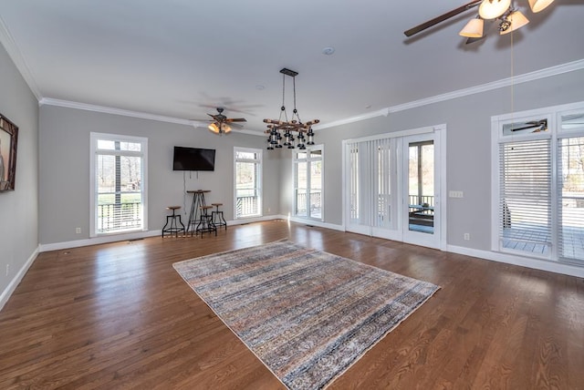 33 Tj Mote Rd, Dahlonega, GA 30533 - living area with a ceiling fan, plenty of natural light, crown molding, dark wood-style flooring, and baseboards