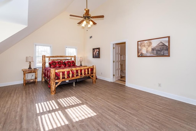 33 Tj Mote Rd, Dahlonega, GA 30533 - bedroom featuring wood finished floors, baseboards, high vaulted ceiling, ceiling fan, and ensuite bathroom