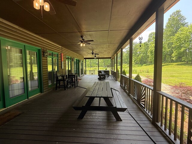 33 Tj Mote Rd, Dahlonega, GA 30533 - wooden deck with ceiling fan and outdoor dining space