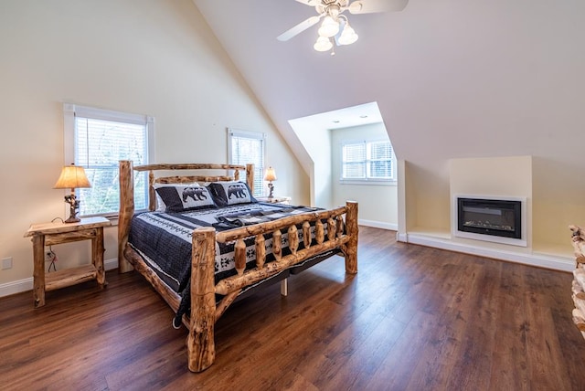 33 Tj Mote Rd, Dahlonega, GA 30533 - bedroom featuring wood finished floors, high vaulted ceiling, baseboards, a glass covered fireplace, and a ceiling fan