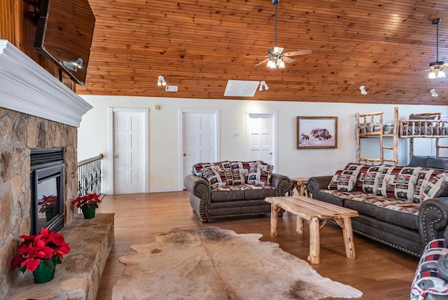 33 Tj Mote Rd, Dahlonega, GA 30533 - living area featuring lofted ceiling, ceiling fan, wood finished floors, a fireplace, and wooden ceiling
