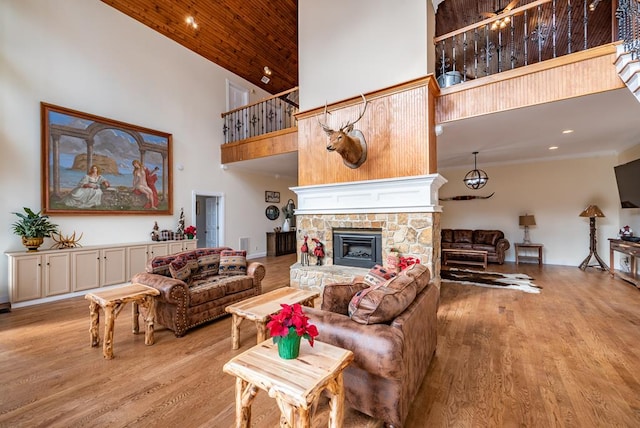 33 Tj Mote Rd, Dahlonega, GA 30533 - living area featuring a high ceiling, light wood-type flooring, a fireplace, and recessed lighting