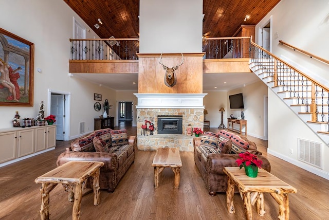 33 Tj Mote Rd, Dahlonega, GA 30533 - living area featuring high vaulted ceiling, wooden ceiling, stairs, baseboards, and wood finished floors