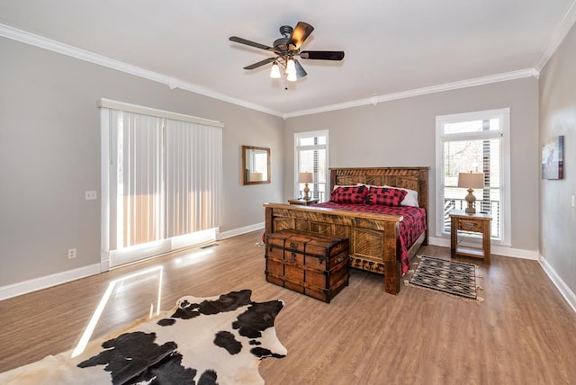 33 Tj Mote Rd, Dahlonega, GA 30533 - bedroom with wood finished floors, crown molding, baseboards, and ceiling fan