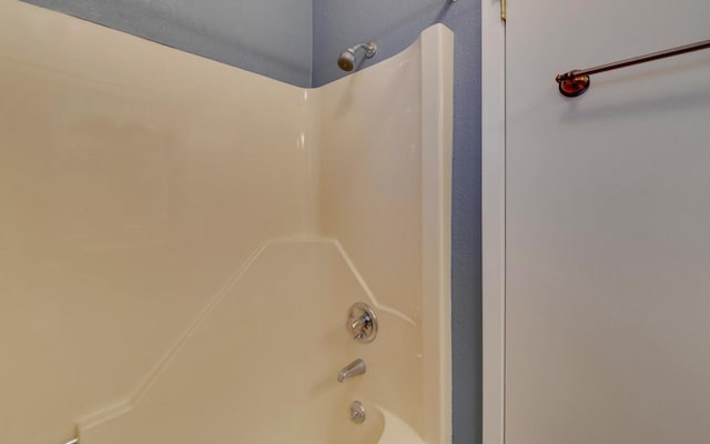 bathroom with shower / bath combination