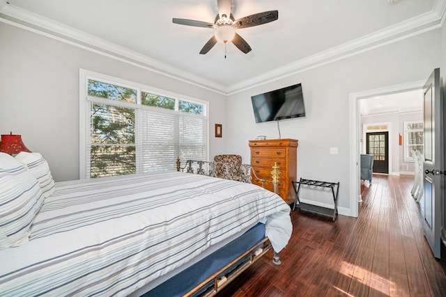 bedroom featuring ceiling fan, dark hardwood / wood-style floors, and ornamental molding