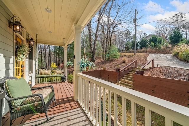 wooden terrace featuring a porch