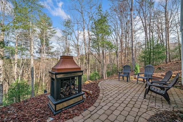 view of patio / terrace featuring exterior fireplace