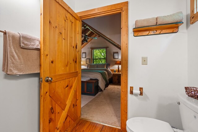 127 Berry Reister Dr, Blairsville, GA 30512 - half bathroom with wood finished floors, toilet, and lofted ceiling