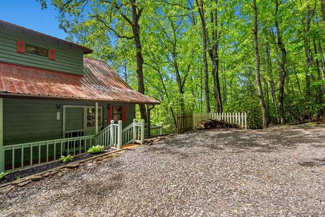 127 Berry Reister Dr, Blairsville, GA 30512 - view of side of home with a porch, fence, and metal roof