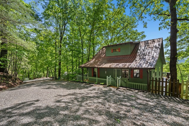 127 Berry Reister Dr, Blairsville, GA 30512 - view of front of house with covered porch, fence, and driveway